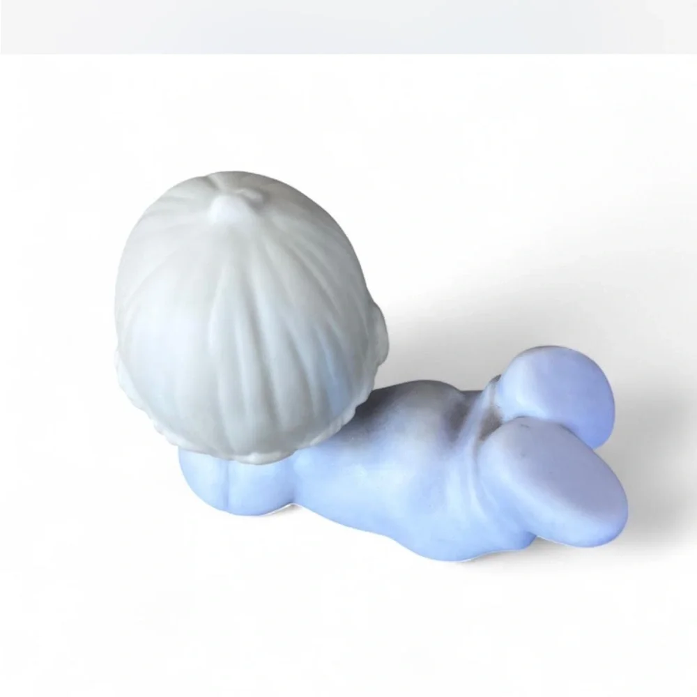 Adorable Precious Moments little girl lying down figurine in excellent condition